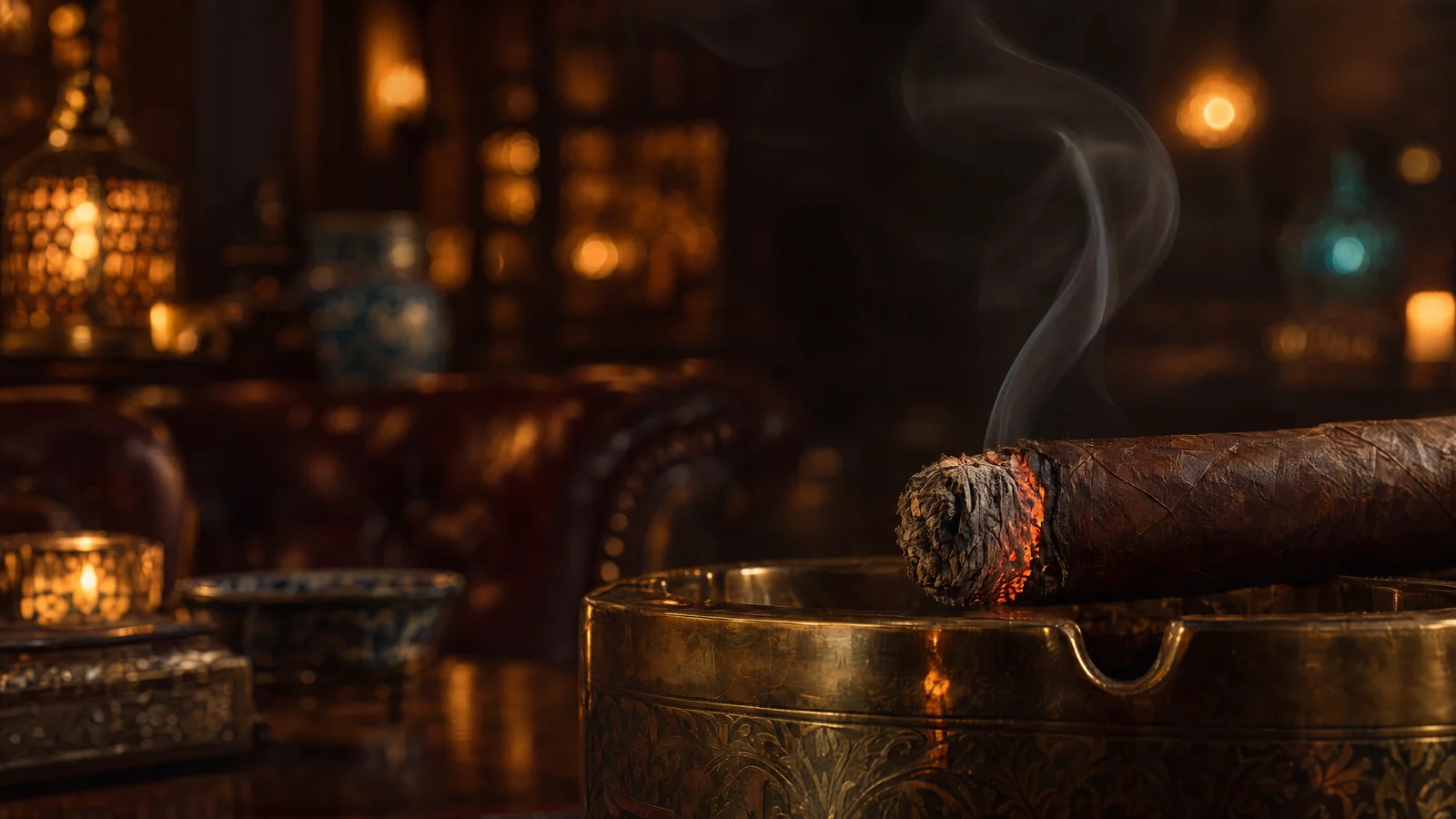 The glowing ember of a cigar resting on a brass ashtray, a thread of smoke rising into warm lantern light.